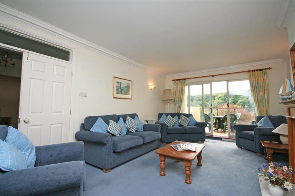 Lounge area with doors leading out to the balcony at Valley View (Salcombe) in Sandhills Road, Salcombe