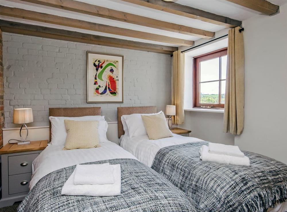 Comfortable twin bedroom with beams at Valley View Barn in Bradbourne, near Ashbourne, Derbyshire
