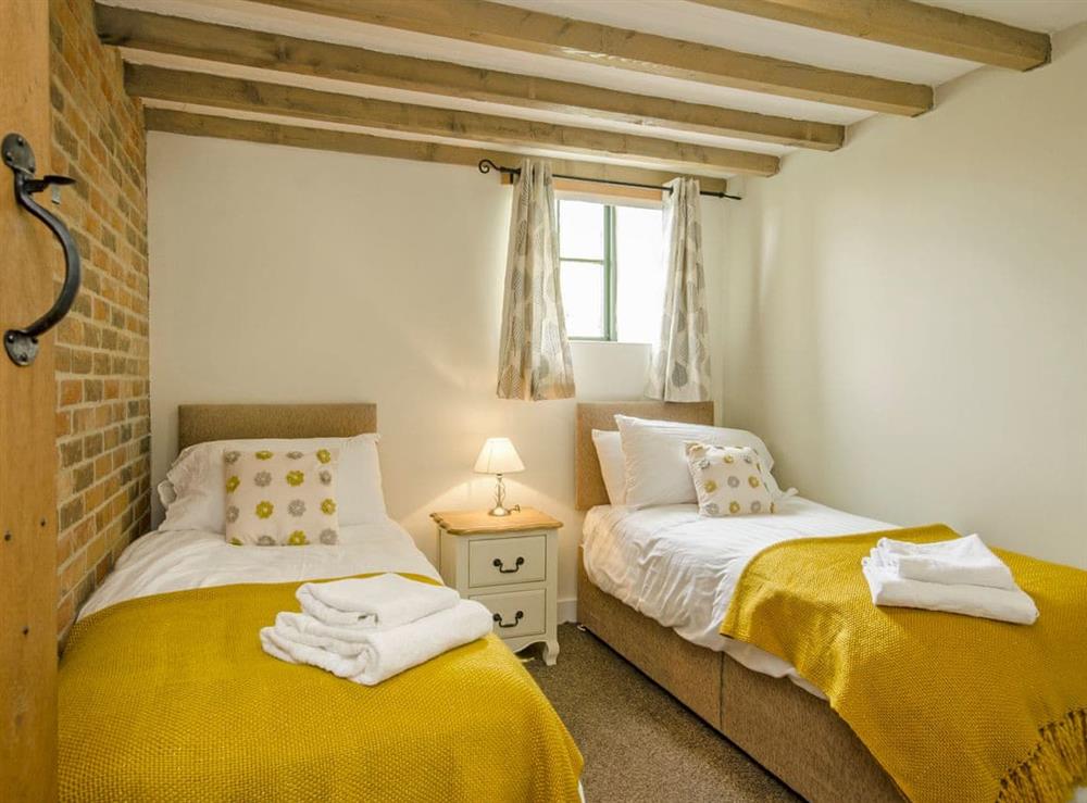 Cosy twin bedroom with beams at Valley View Barn in Bradbourne, near Ashbourne, Derbyshire