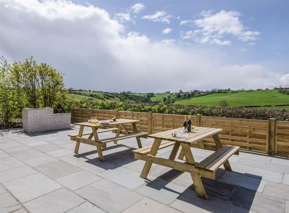 Outdoor seating area with stunning views at Valley View Barn in Bradbourne, near Ashbourne, Derbyshire