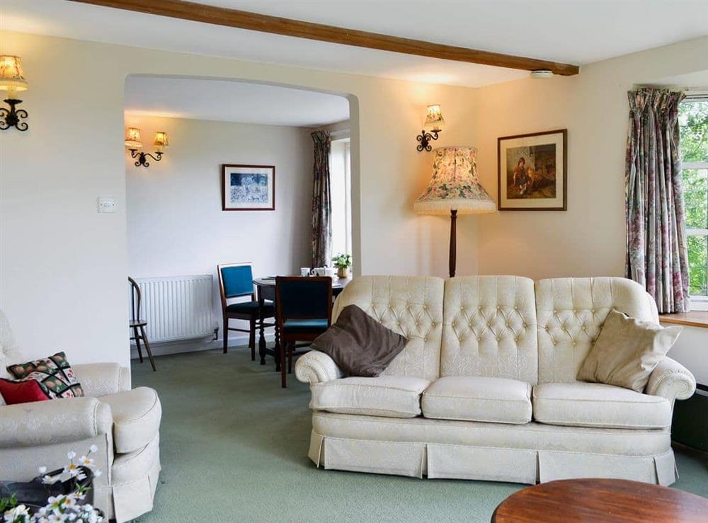 Relaxing living room leading to the dining area at Valley View in Dalwood, near Axminster, Devon