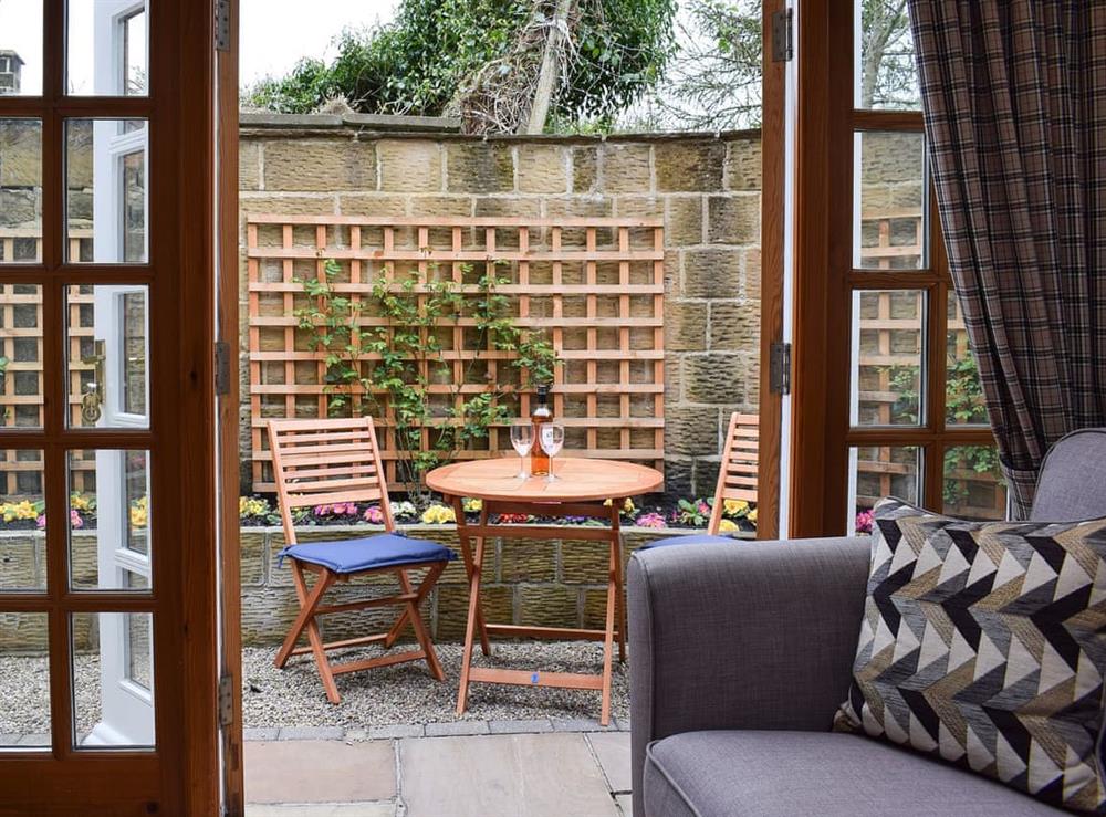 French doors with outdoor seating area at Vanehouse Apartment in Osmotherley, near Northallerton, Yorkshire, North Yorkshire