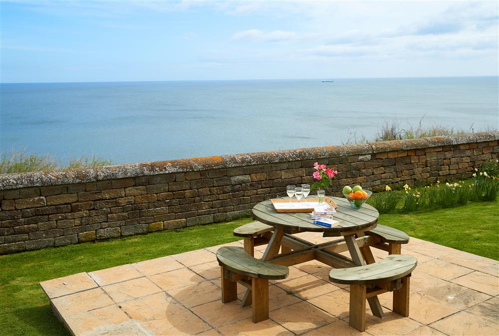 Patio area with picnic style garden furniture at Vanguard, Whitby Lighthouse