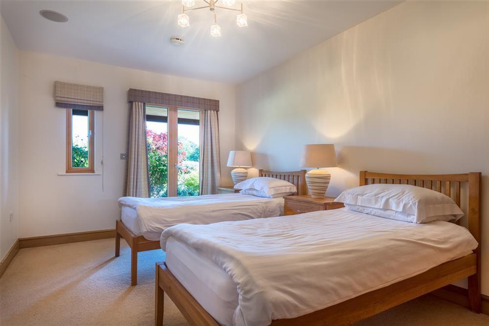 Ground floor bedroom with twin beds and French windows to the South (photo 2) at Vantage Point in Hillfield, Dartmouth
