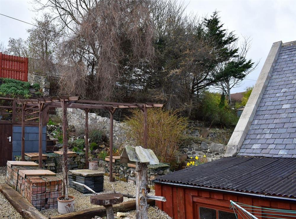 Pergola with quirky seating and table at Viaduct View in Cullen, near Buckie, Highlands, Banffshire
