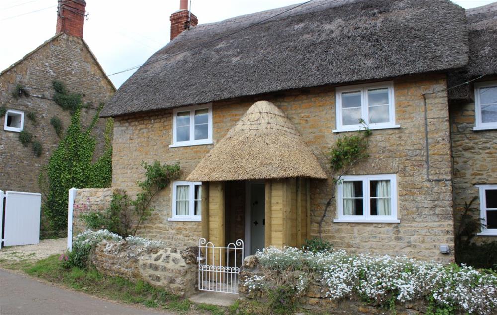 Vicarage Cottage is a beautiful, detached, Grade II listed, thatched cottage located in the charming village of Powerstock