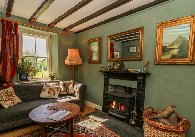 Relax in the living area at Victorian Farmhouse, Ty Mawr near Llanybydder
