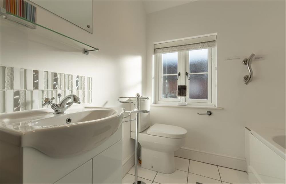 First floor: Family bathroom has bath and shower over at Victory Cottage, Little Walsingham