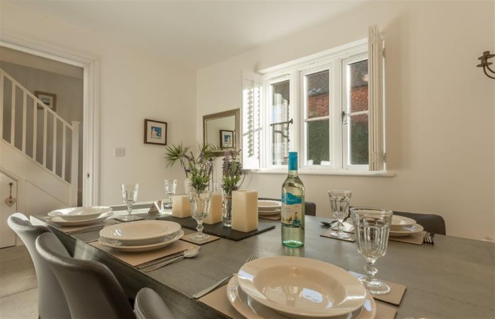 Ground floor: Dining room has zinc top dining table at Victory Cottage, Little Walsingham