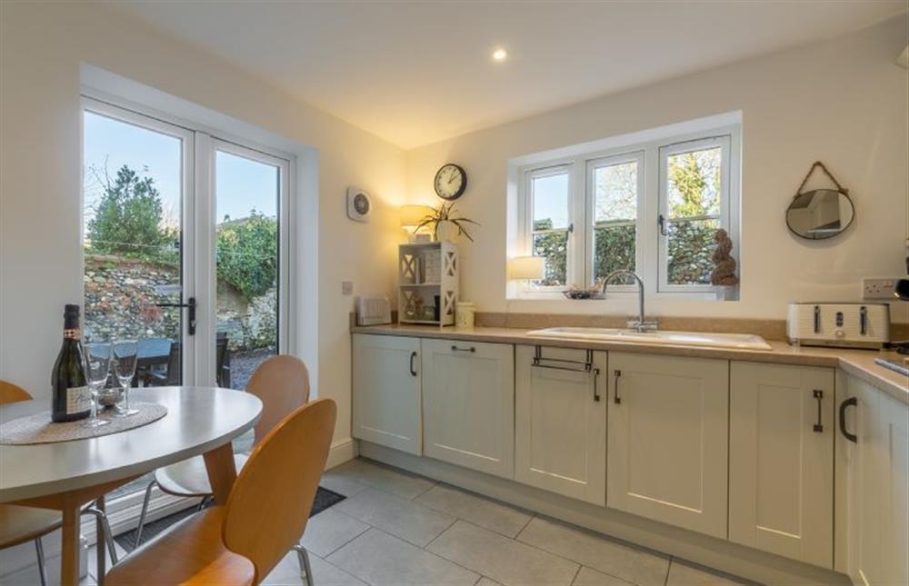 Ground floor: The kitchen has french doors onto the patio at Victory Cottage, Little Walsingham