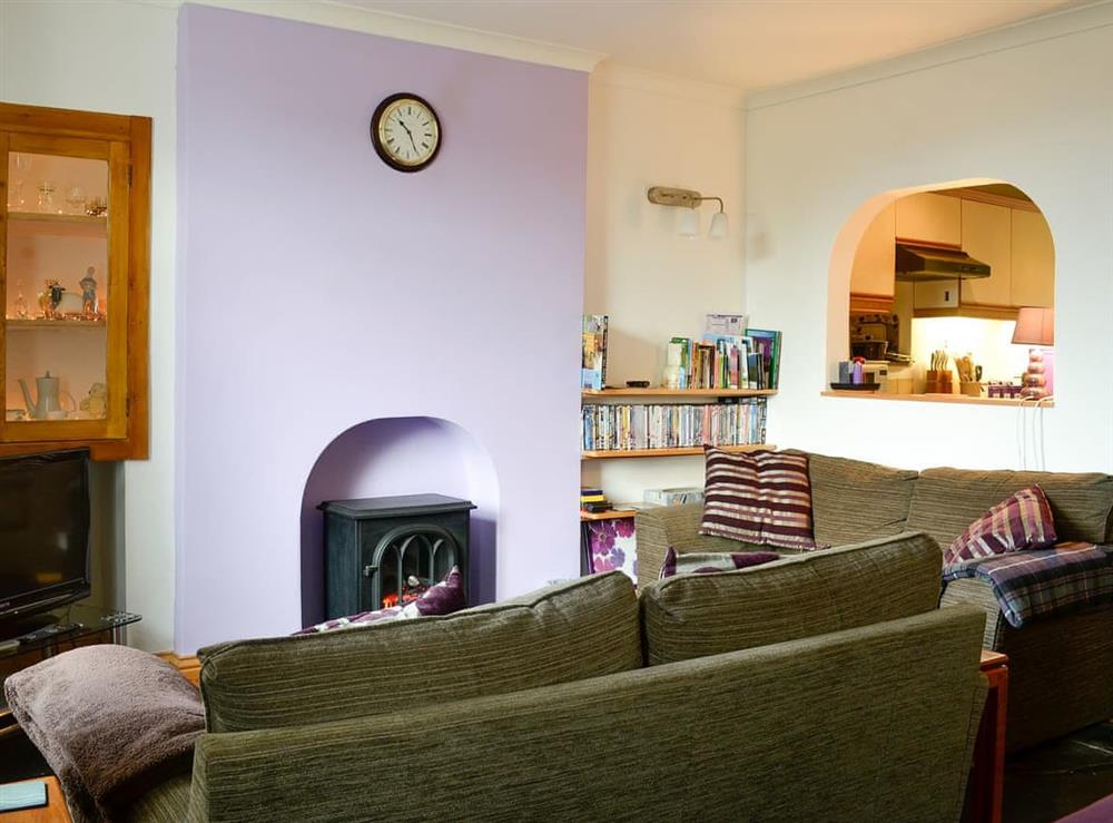Delightful living space with electric woodburner at View Cottage in Settle, North Yorkshire