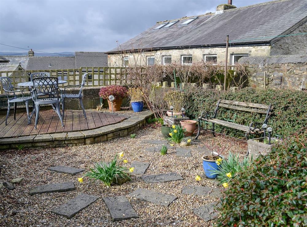 Gravelled garden with raised decked area at View Cottage in Settle, North Yorkshire