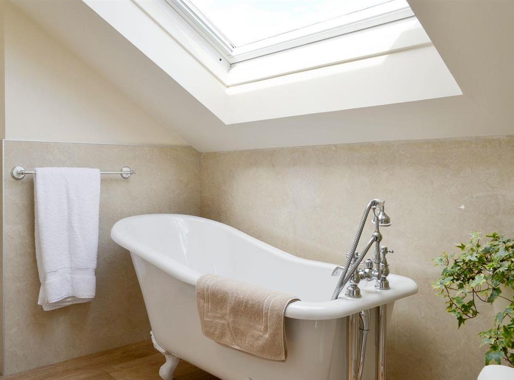 Bathroom with stylish roll-top bath at Caledonian, 