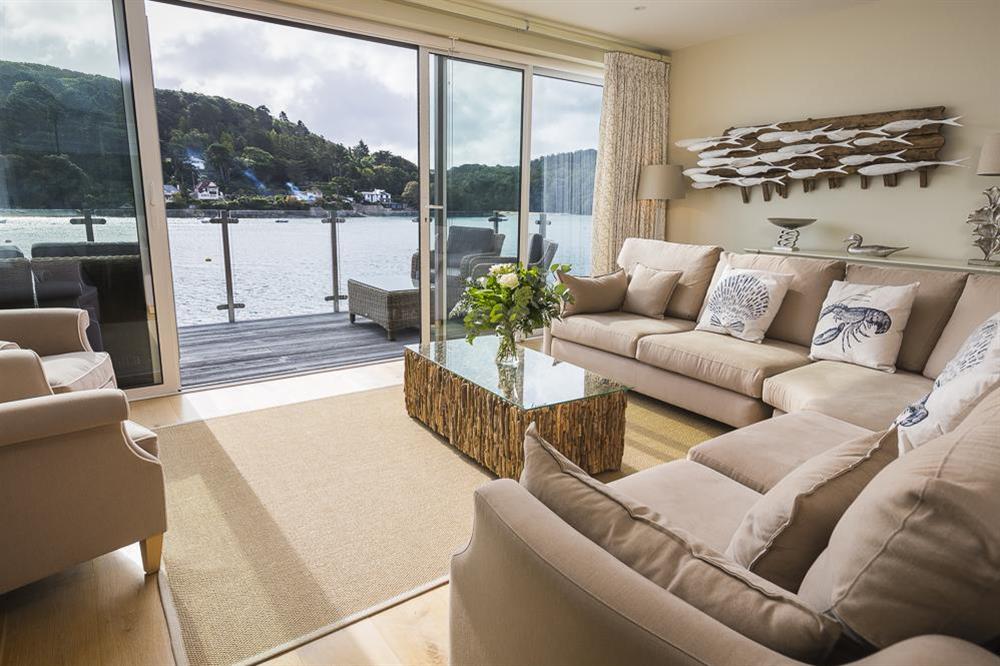 Beautifully furnished sitting area with bi-folding doors to the balcony at Villa 1, Estura in , Salcombe