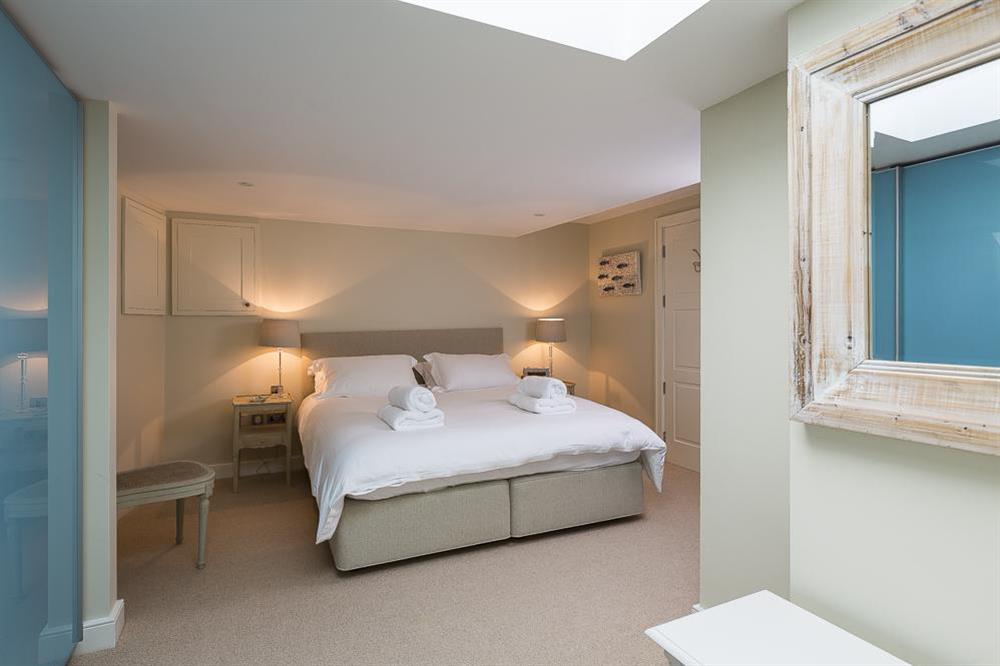 Lower ground floor en suite bedroom with King-size bed at Villa 1, Estura in , Salcombe