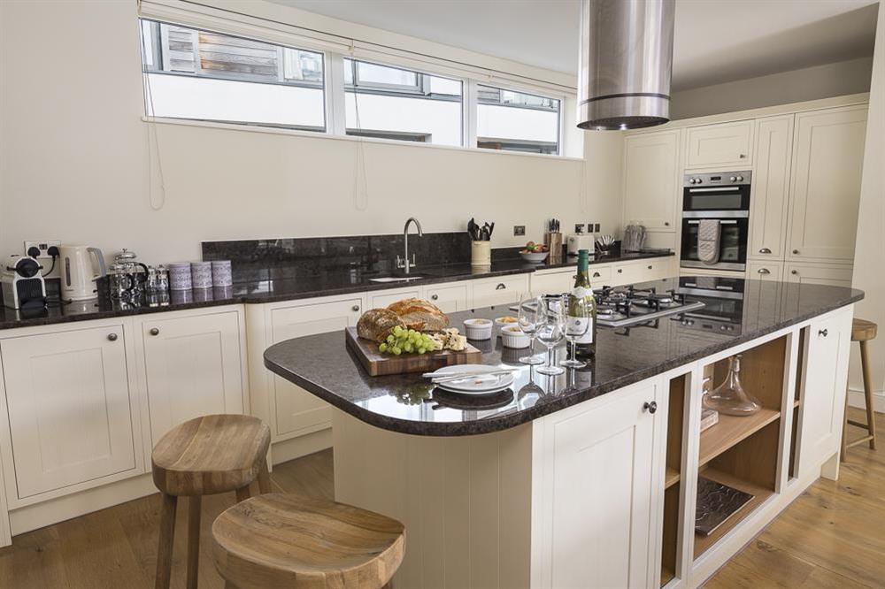 Spacious kitchen/dining area with beautiful oak flooring at Villa 1, Estura in , Salcombe