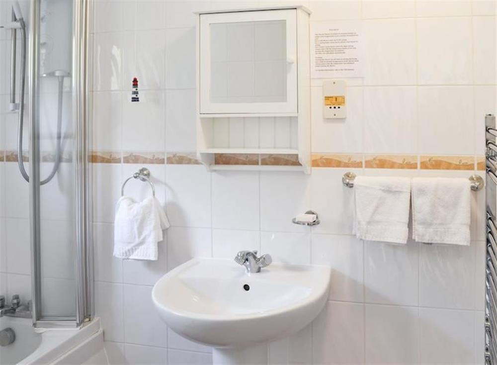 Bathroom with under-floor heating and large heated towel rail. at Villa 55 in Cromer, Great Britain