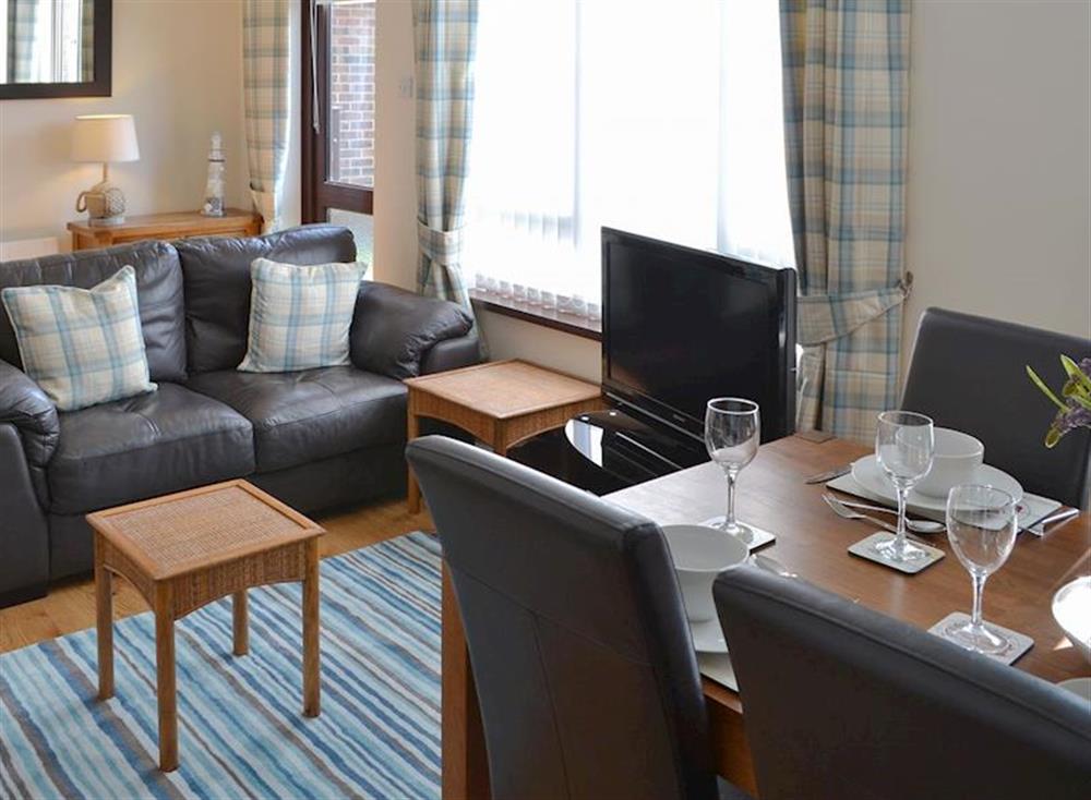 Comfortable living/ dining room at Villa 55 in Cromer, Great Britain