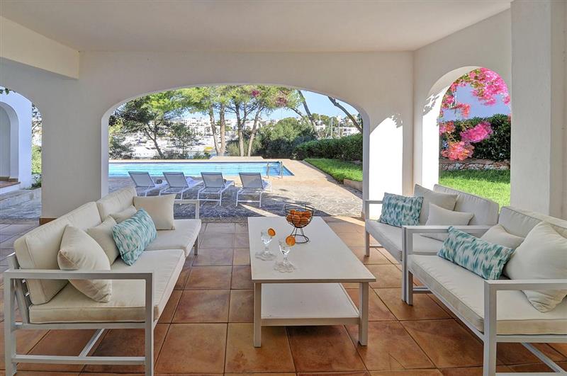 Shaded seating area at Villa Calo Bay, Cala dOr, Spain