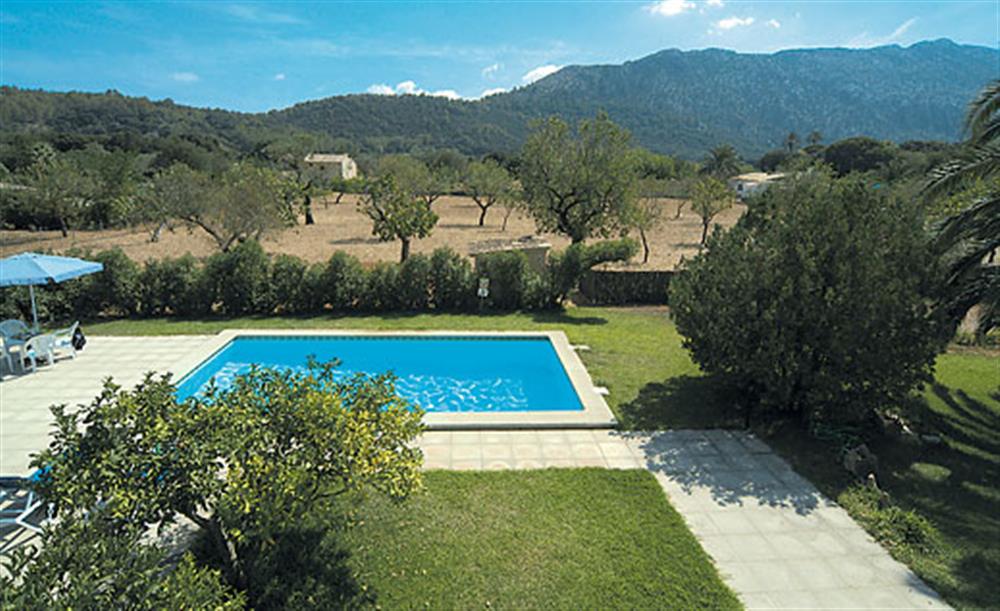 Swimming pool and garden at Villa Can de Lausina, Pollensa Mallorca, Spain