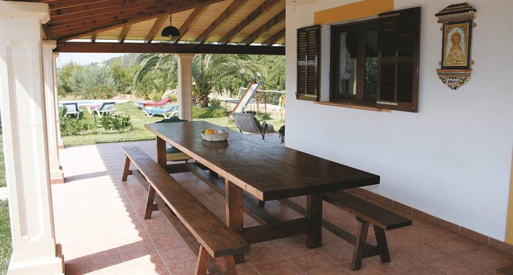 Shaded dining outside Villa Can Moscard at Villa Can Moscard, Pollensa, Majorca
