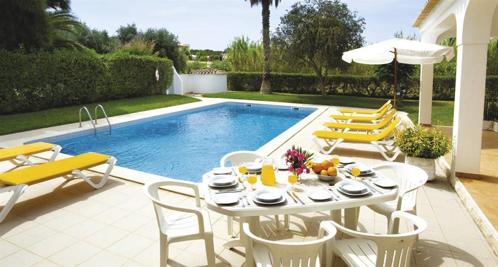 Swimming pool and sun loungers at Villa Casa do Marco, Sesmarias, Algarve