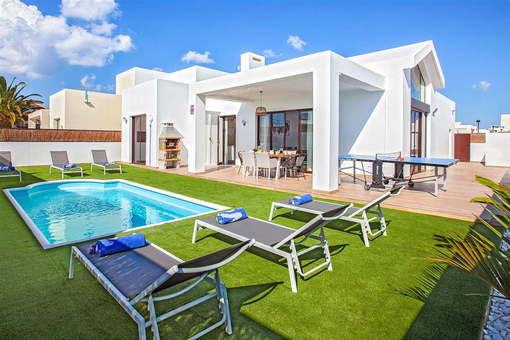 Villa exterior, pool, sunloungers at Villa Cindy, Playa Blanca, Lanzarote