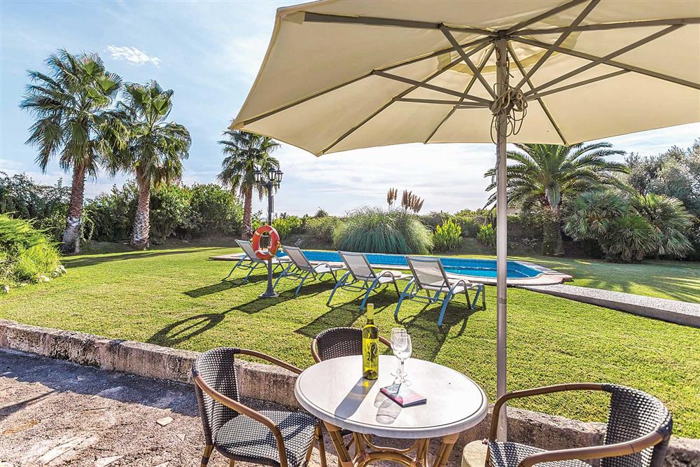 Garden, alfresco dining, pool at Villa Cosme, Pollensa, Mallorca, Spain
