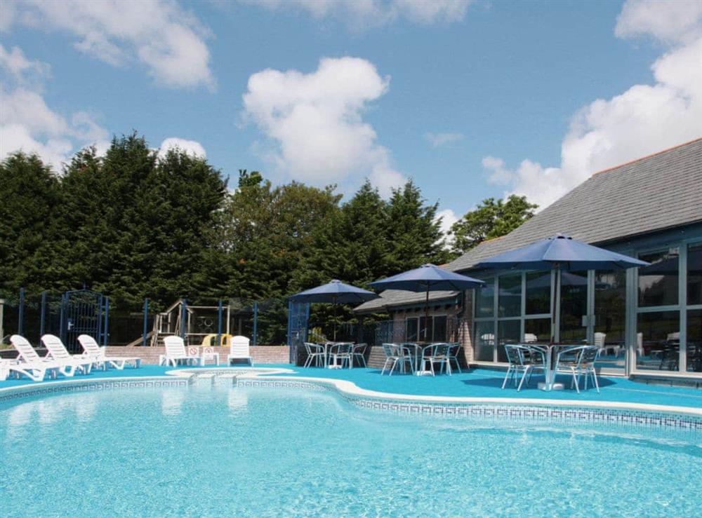 Shared swimming pool and hot tub at Villa Gallery in Carnon Downs, near Truro, Cornwall