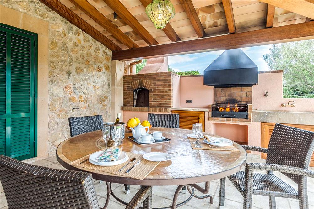 Alfresco dining, barbecue, covered terrace at Villa Les Oliveres, Puerto Pollensa, Mallorca