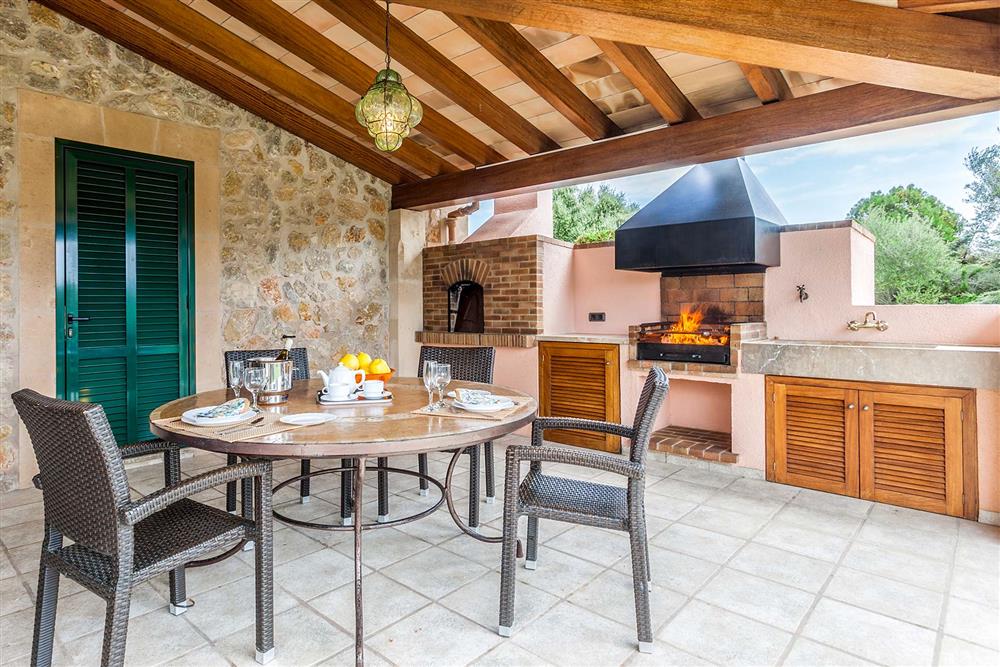 Alfresco dining, covered terrace, barbecue at Villa Les Oliveres, Puerto Pollensa, Mallorca