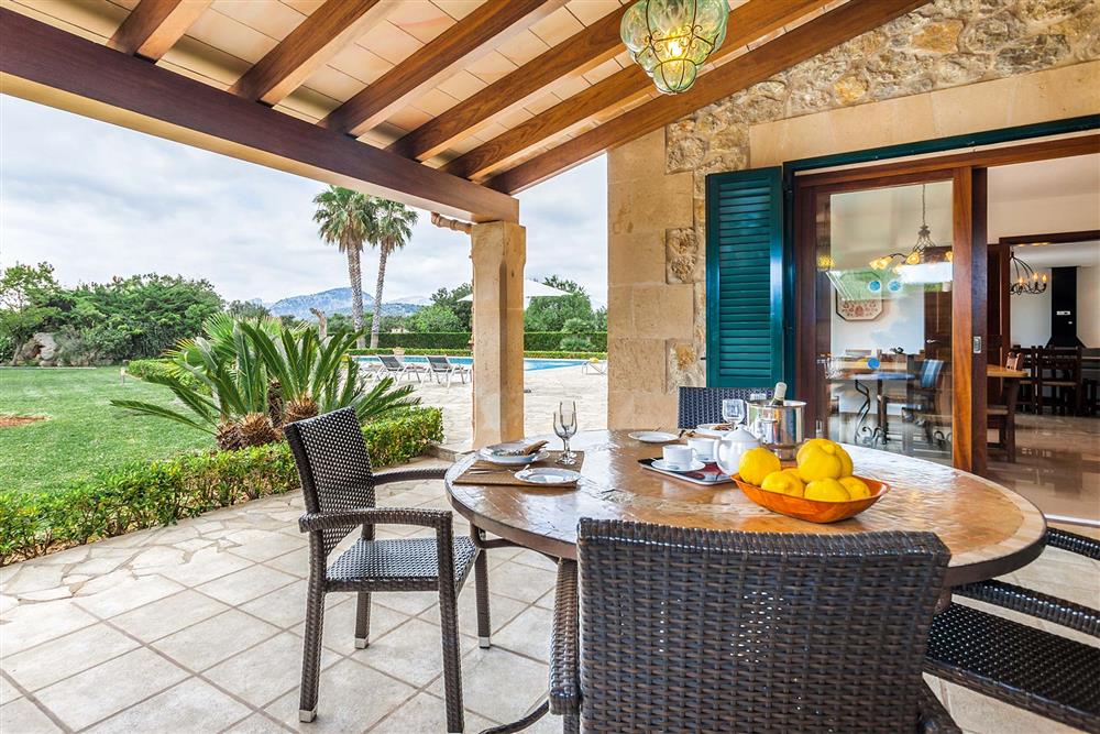 Alfresco dining, covered terrace, garden at Villa Les Oliveres, Puerto Pollensa, Mallorca