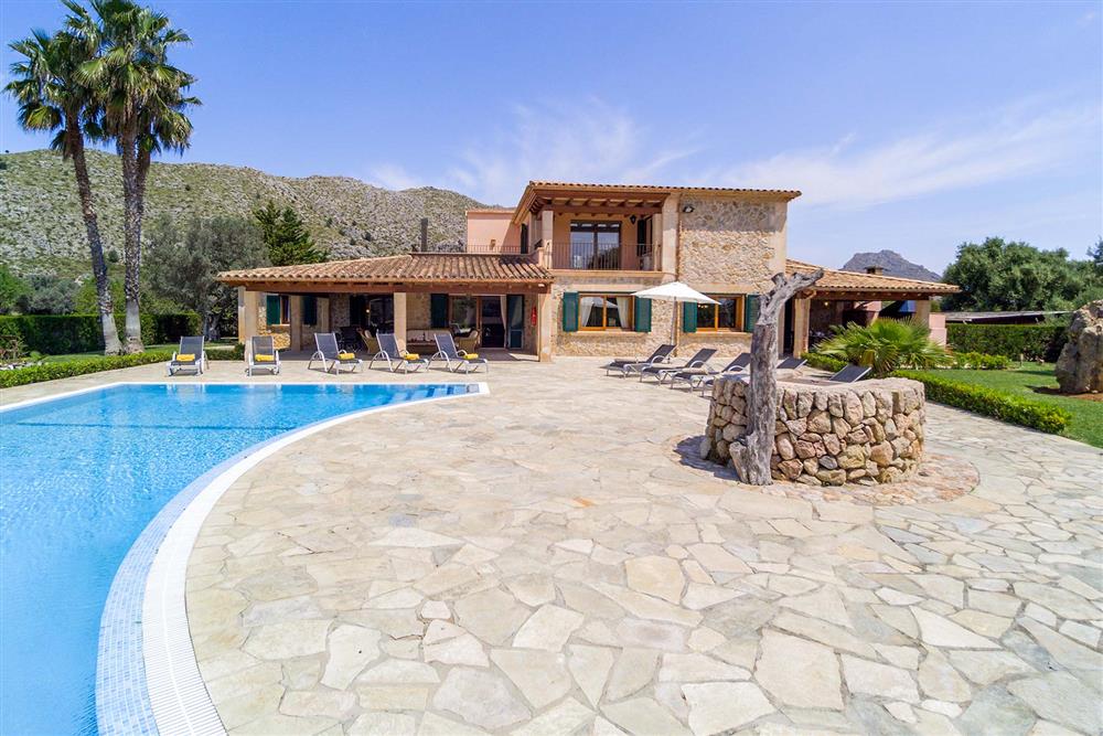 Villa exterior, pool, sunloungers at Villa Les Oliveres, Puerto Pollensa, Mallorca