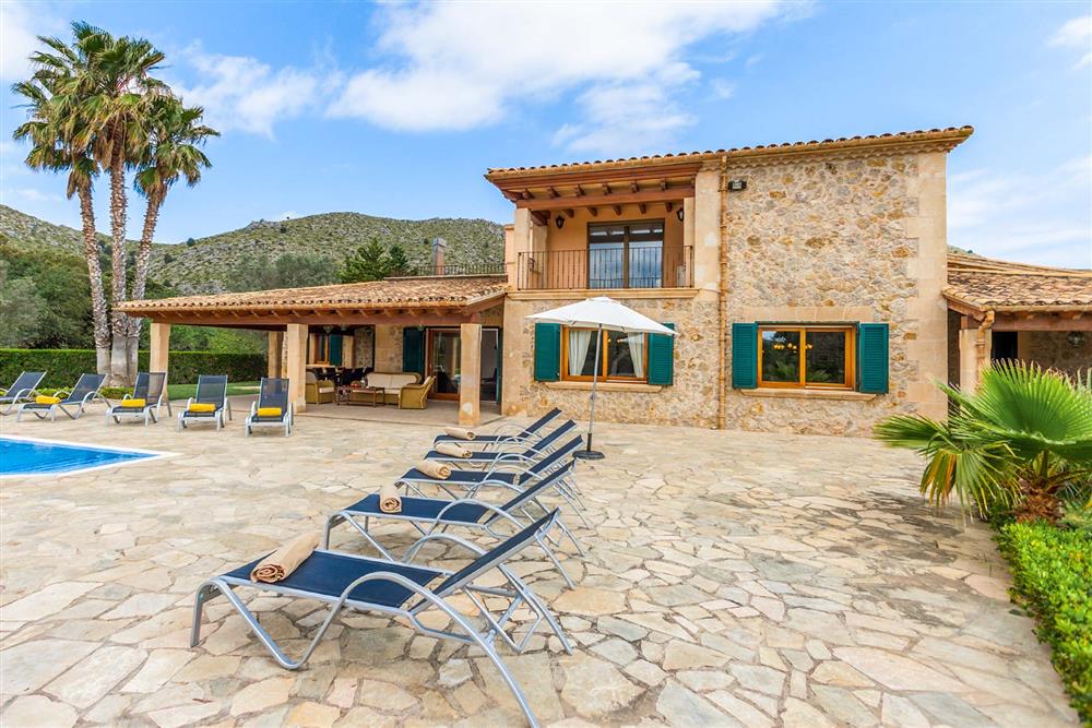 Villa exterior, sunloungers at Villa Les Oliveres, Puerto Pollensa, Mallorca
