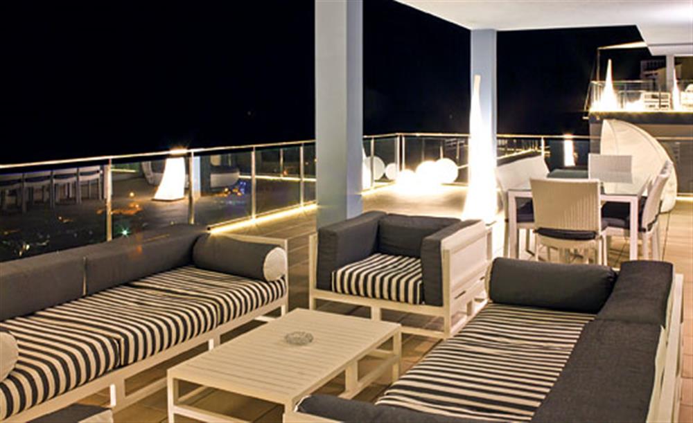 Outdoor seating at night at Villa Prestige, Son Bou, Menorca
