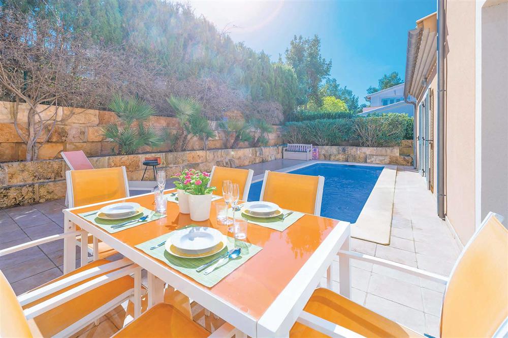 Alfresco dining, pool at Villa Synera, Alcudia, Mallorca