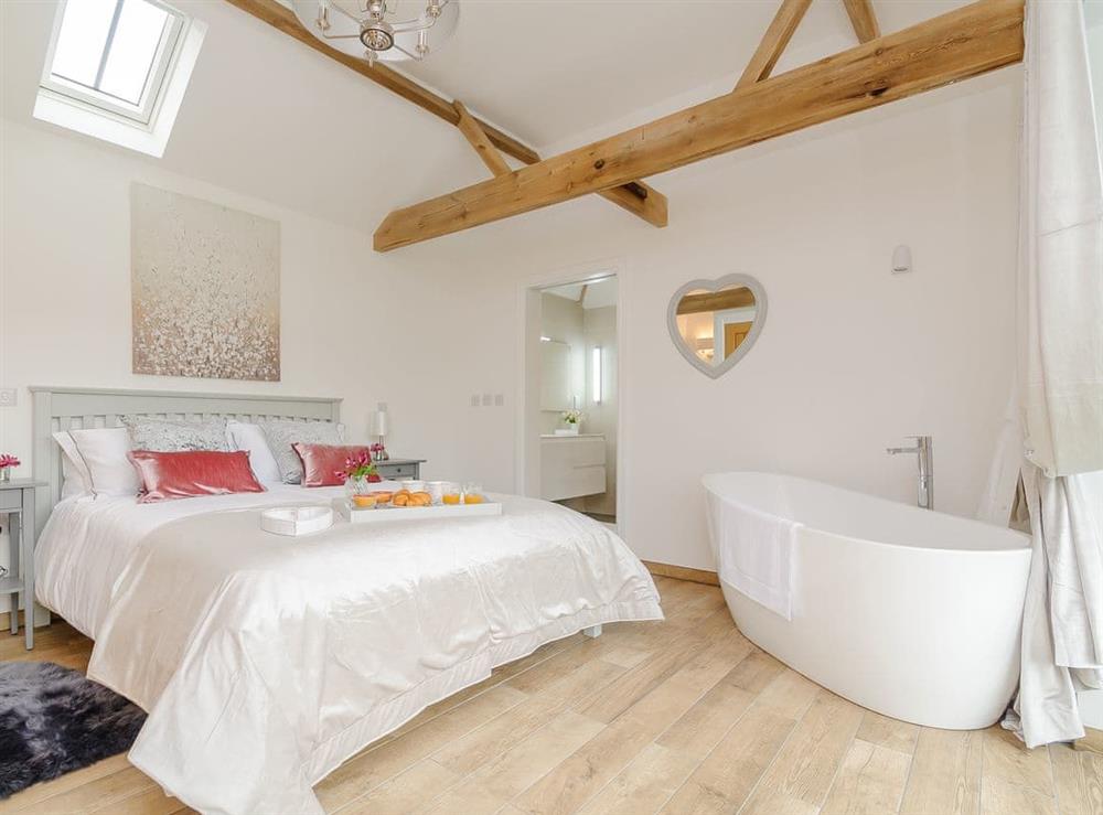Double bedroom with stand alone bath at The Parlour, 
