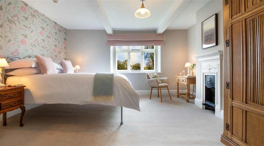 The first king-size bedroom at Village Farmhouse in Altrincham, Cheshire
