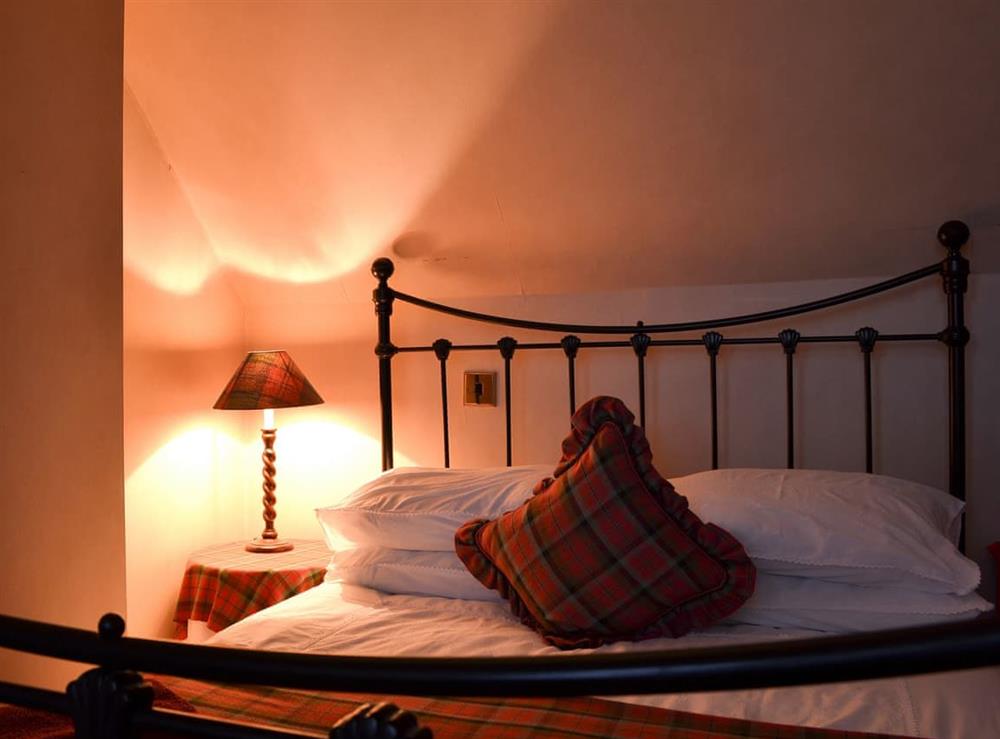 Lovely bedroom with antique style bed at Vindolanda in Fearnbeg, near Applecross, Ross-Shire