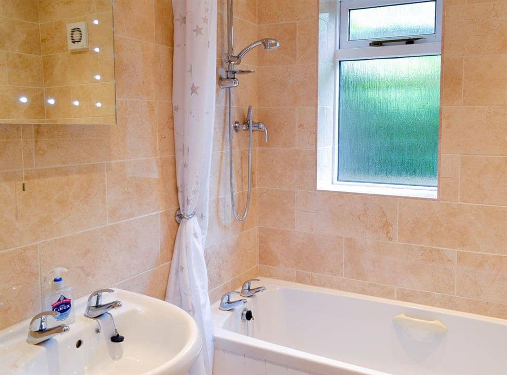 Bathroom with shower over bath at Vine Lodge in Bovey Tracey., Devon