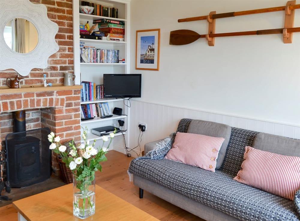 Comfortable living room with wood burner at Violet Cottage in Kingsdown, near Deal, Kent