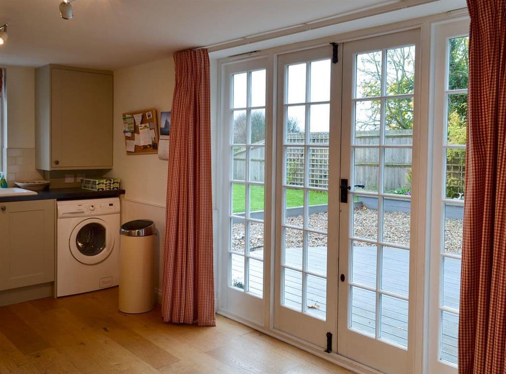French doors from the kitchen lead onto a delightful terrace at Violet Cottage in Kingsdown, near Deal, Kent