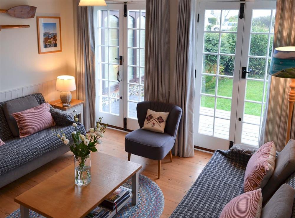 French doors from the living room lead onto a delightful terrace at Violet Cottage in Kingsdown, near Deal, Kent