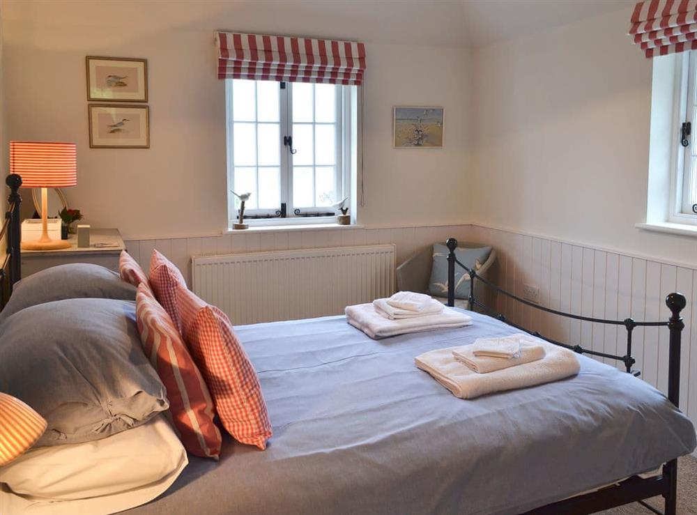 Tranquil bedroom with kingsize bed at Violet Cottage in Kingsdown, near Deal, Kent