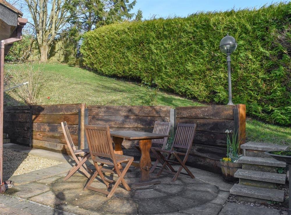 Paved patio area with outdoor furniture at Virginia Lodge in Watchet, near Minehead, Somerset