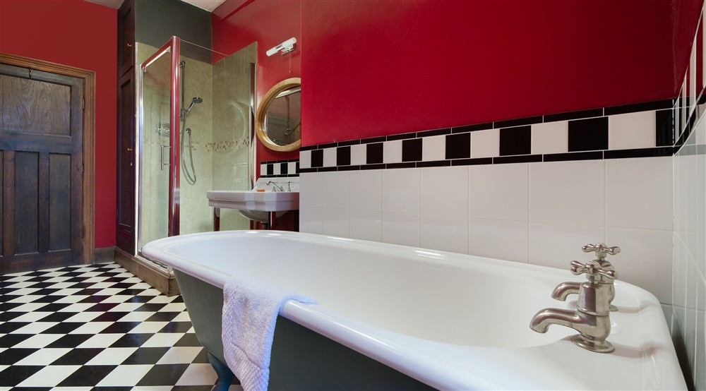 The bathroom with roll-top bath and walk-in shower at Vyner in Ripon, North Yorkshire