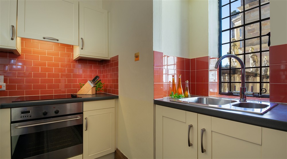 The kitchen with views of Fountains Hall at Vyner in Ripon, North Yorkshire