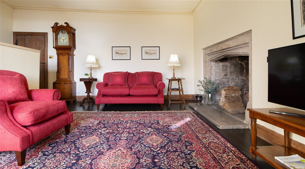 The sitting room with sofa, armchair and television at Vyner in Ripon, North Yorkshire