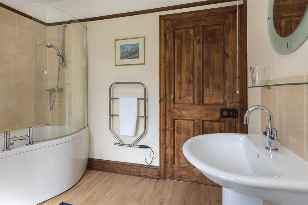 Family bathroom with bath/shower at Waders in Bonaventure Road, Salcombe