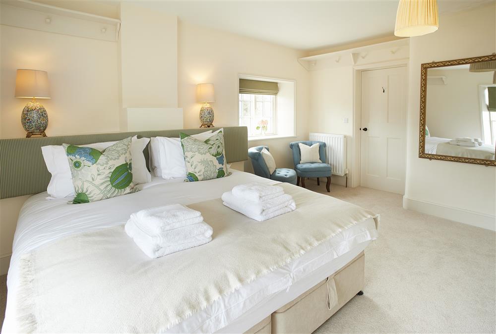 Bedroom four with 6’ super-king zip and link bed and en suite shower room at Walesby House, Walesby